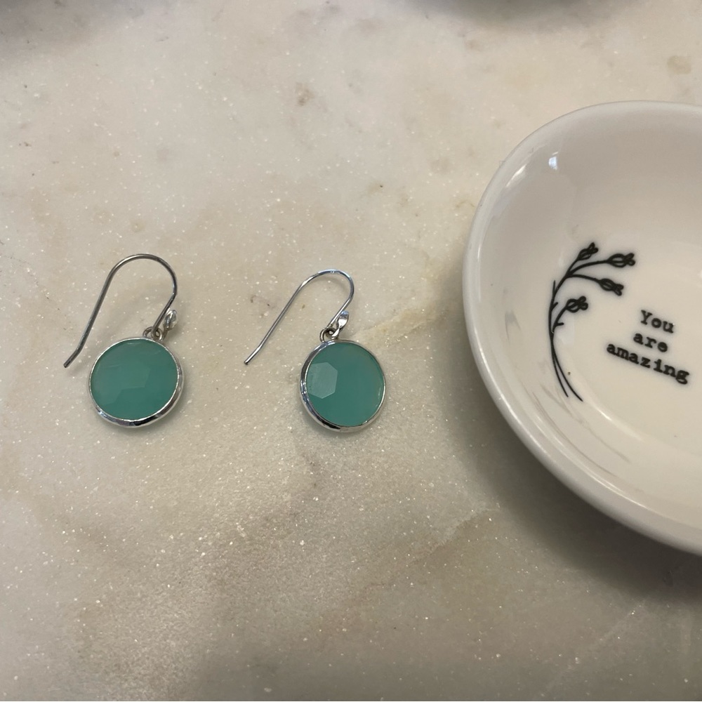 Blue earrings with silver accent.